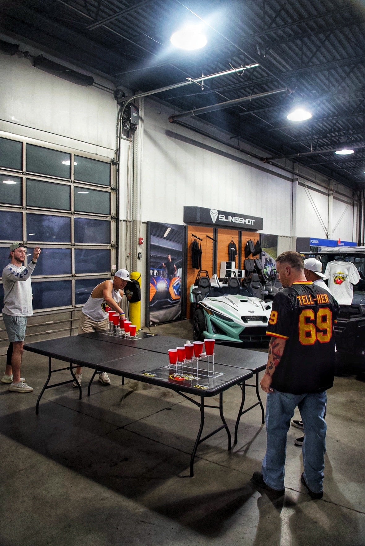 Shenanigans Pong - Fast-Paced Competitive Party Game Shoot, Bounce & Flip Cup Race Game. Includes 2 Silicone Mats, Cups & Balls  completive beer pong.